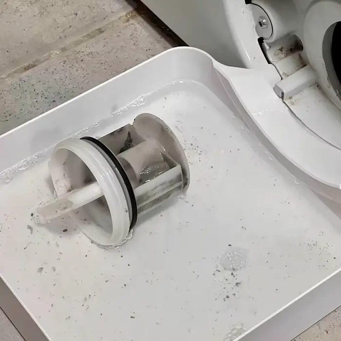 Bac de nettoyage du filtre de machine à laver : récupère l'eau résiduelle et les taches de peluches